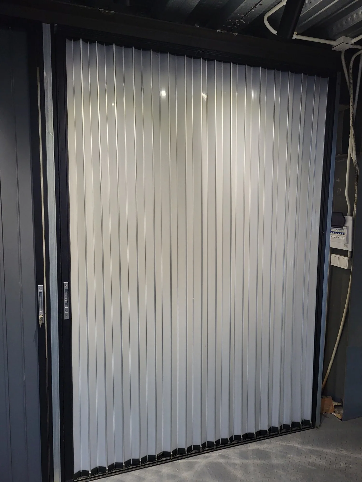 Aluminum folding partition with translucent vertical panels