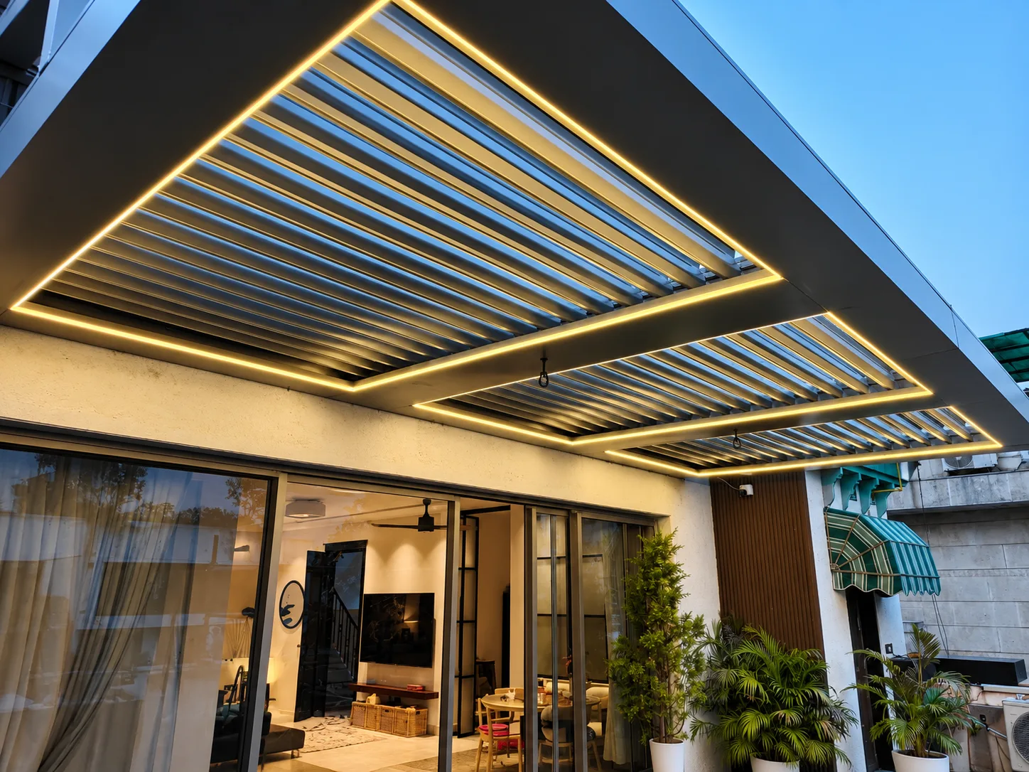 Prato louvered pergola with warm lighting at a residence