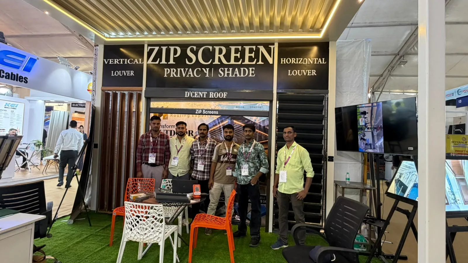 D’cent Roof exhibition display with illuminated roofing and zip screens